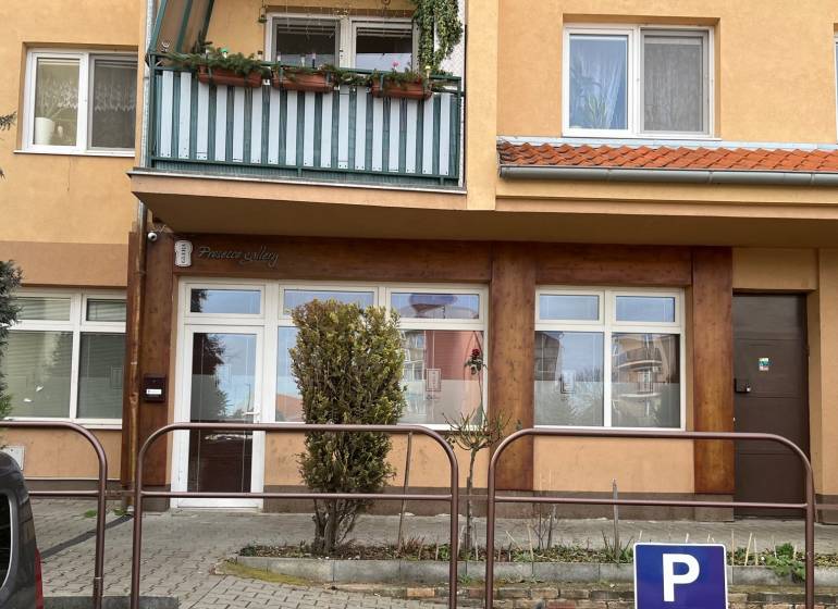 Commercial premises on Kysucká Street in Senec with a glass facade and a balcony.