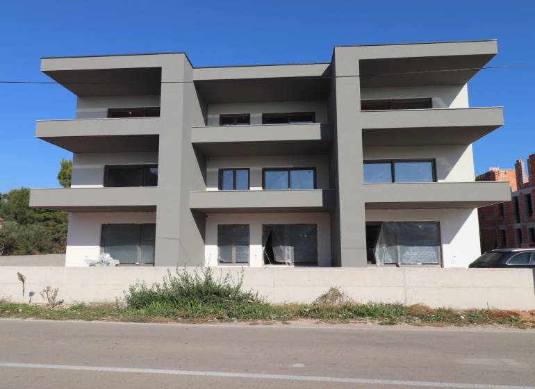The exterior of a newly built holiday apartment in the town of Vodice with a modern facade.