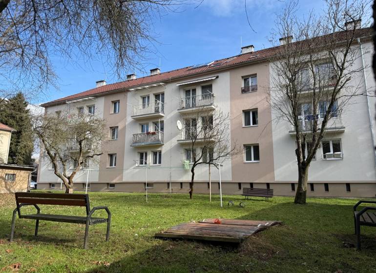 Apartment building on Ľ. Štúr Street in the city of Zvolen with surrounding greenery.