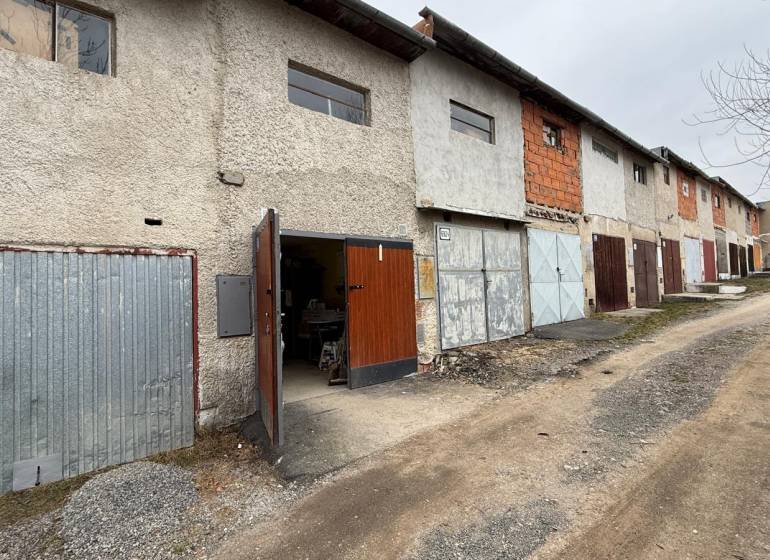 Garages on Prachatická Street in Zvolen with various types of doors and facades.