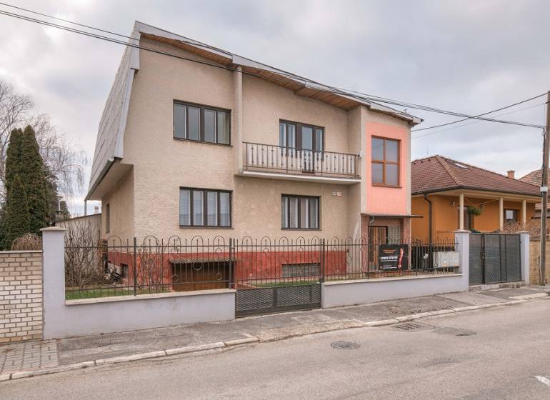 Family house on Kpt. Jaroša Street, Trenčín, with a fenced garden and a balcony.