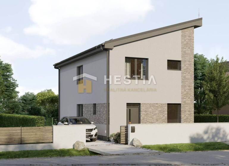 A family house in Cerová with a narrow roof and white facade, surrounded by greenery.
