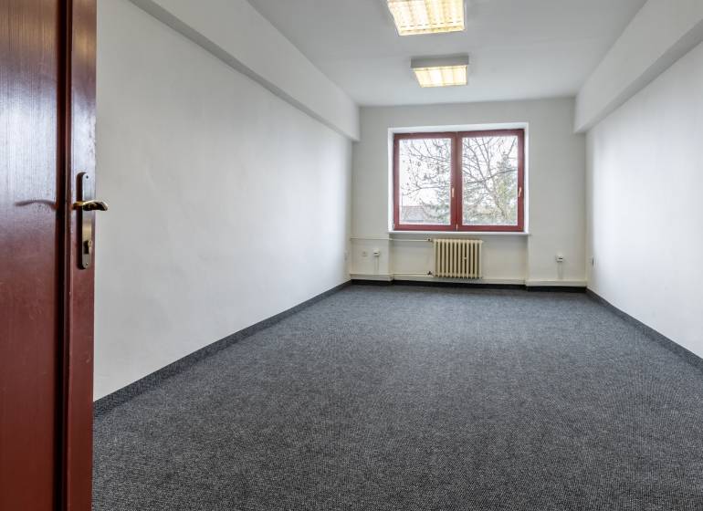 Empty office with carpet, white walls, and a window, Offices.