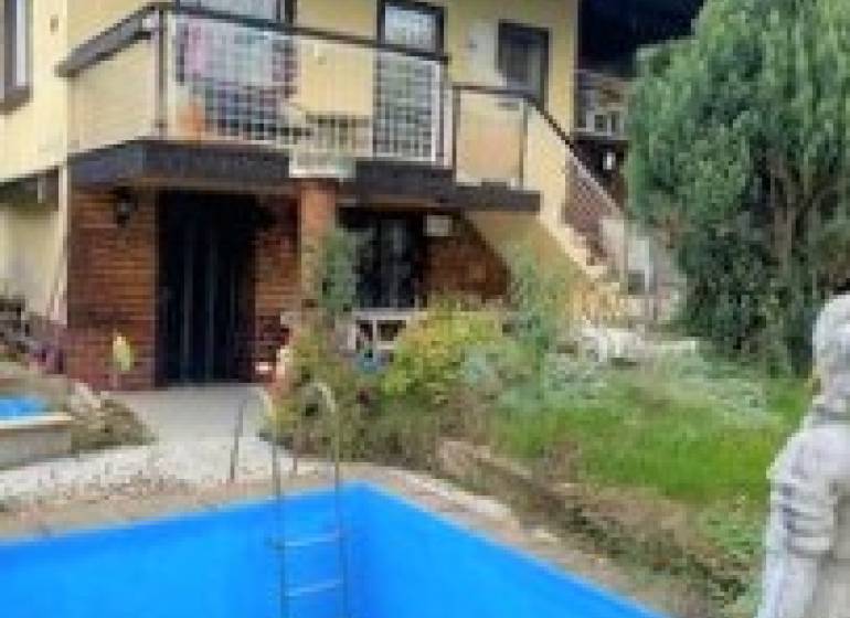 Exterior photograph of a cottage in Košice - Vyšné Opátske district, with verification by a real estate agency.