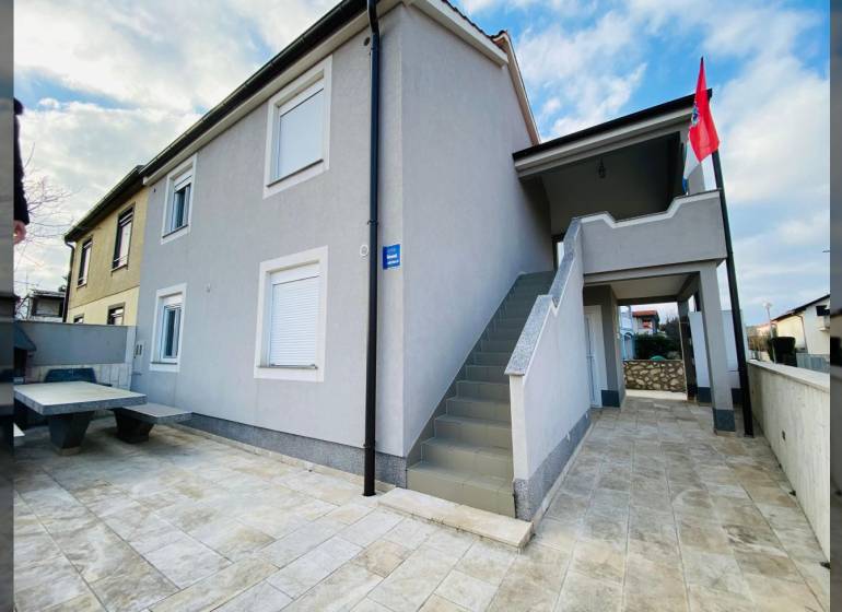 A family house on Grbi Street in Nin with an external staircase and a terrace.