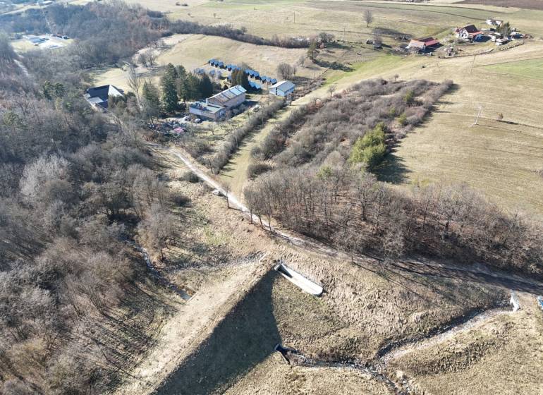 Aerial view of residential plots around Krupina with natural scenery.
