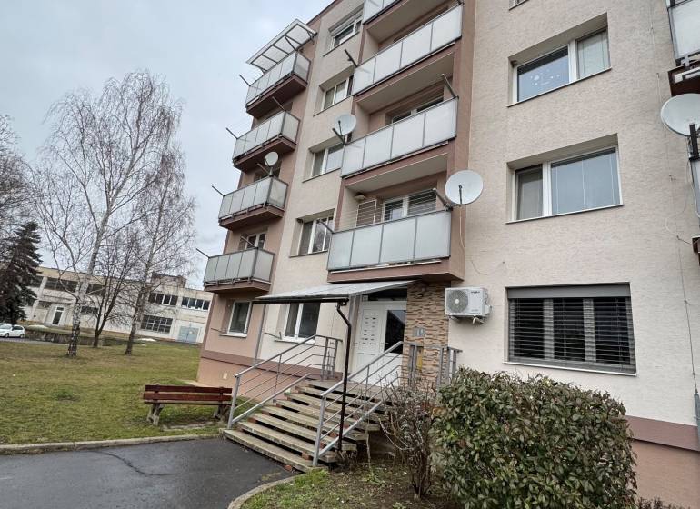 Apartment building on Thuroczyho Street in Šahy with multiple balconies and an entrance path.