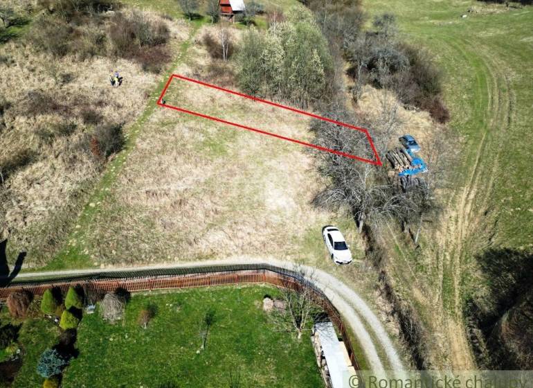 Plots - housing in Vydrná, bordered in red, near the road and tree.