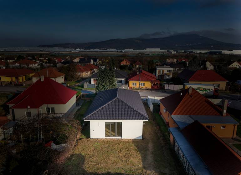 A family house on Rastislavova Street in Lužianky surrounded by other houses and greenery.