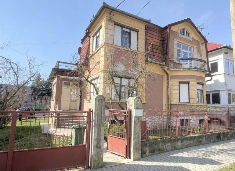 A family house on Gorkého Street in Rimavská Sobota with a front garden and an entrance gate.