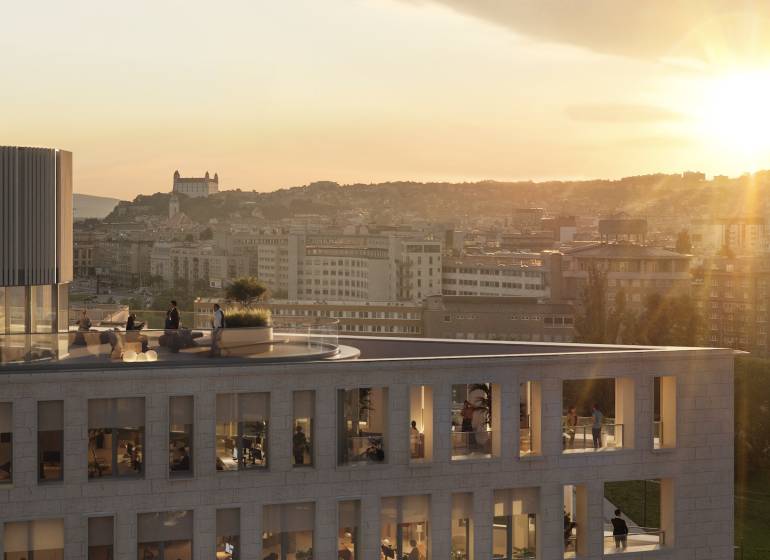 A view of the building at sunset in Bratislava, Pribinova, with a view of the castle.