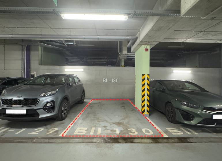 Parking spot BII-130 between two cars in the garages.