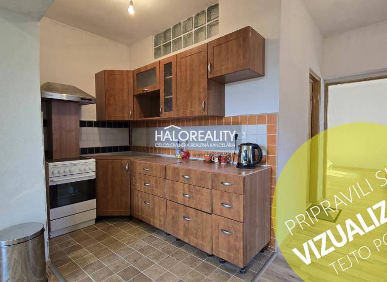 A kitchen in a family house with wooden decor cabinets and tiled flooring.