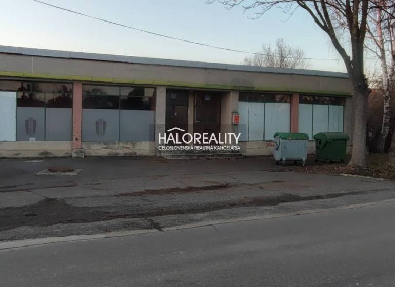 Property for sale: building with display windows, suitable for commercial spaces, main street.