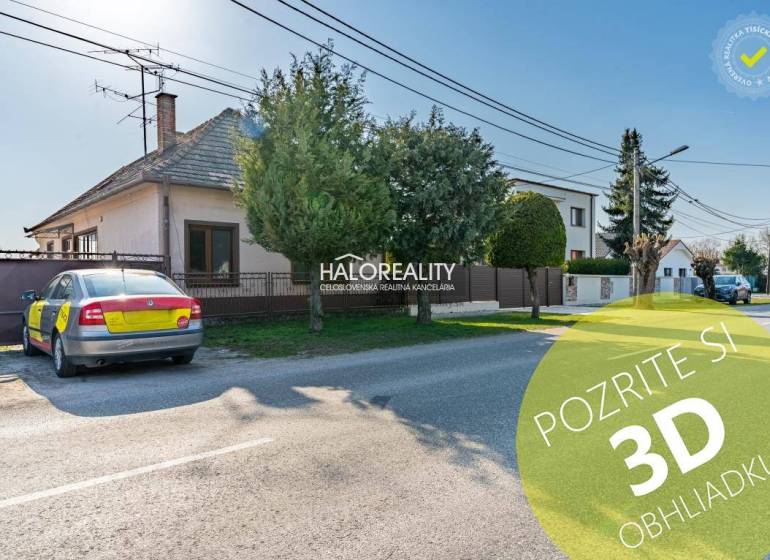 A family house in Horná Potôň with a parking lot and a well-maintained garden by the road.