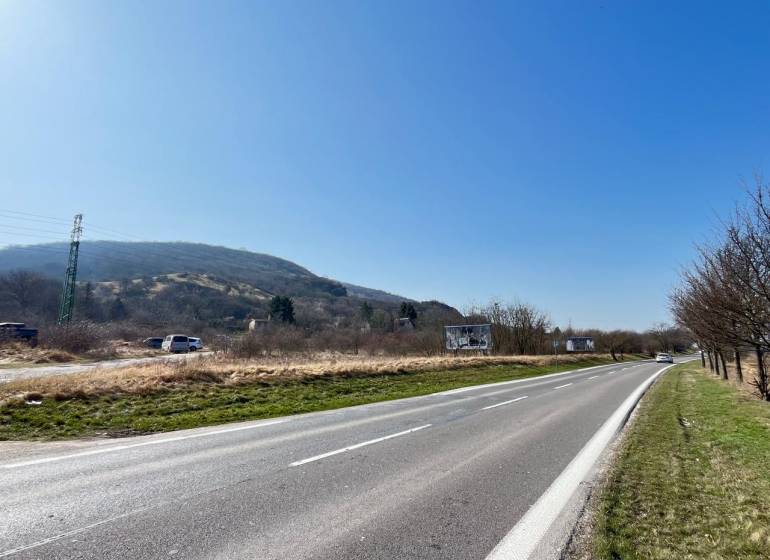 Road by the plots in Bratislava - Devínska Nová Ves with a view of the hills.