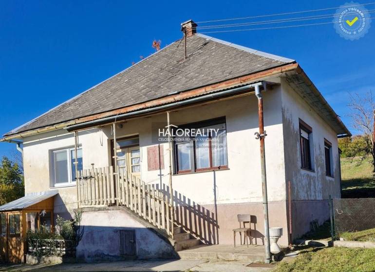 A family house in Malá Lehota with a pitched roof, staircase, and garden.