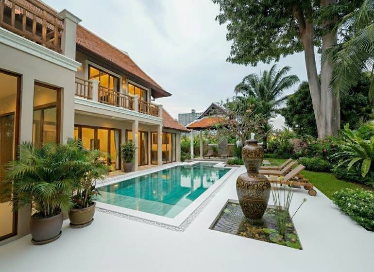 Villa in Pattaya with a pool, exotic garden, and spacious terrace for relaxation.