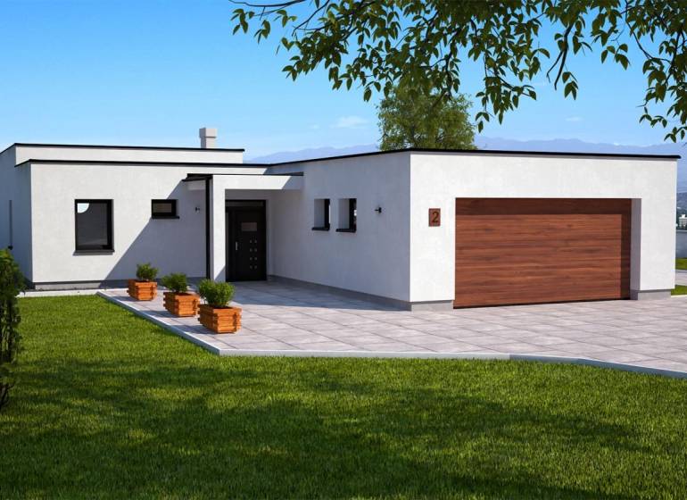 A family house in Dolná Seč with a white facade, a large terrace, and a green lawn.