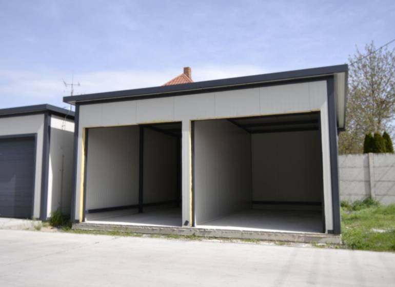 Garages in Michal na Ostrove with gray walls and empty interiors.