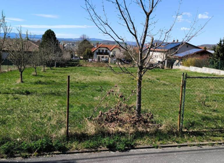 Plots - housing in Ľubotice with fruit trees and a view of the surrounding landscape.
