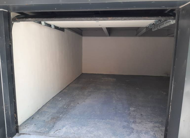 An empty garage on Gajova Street in Bratislava - Old Town with a concrete floor.