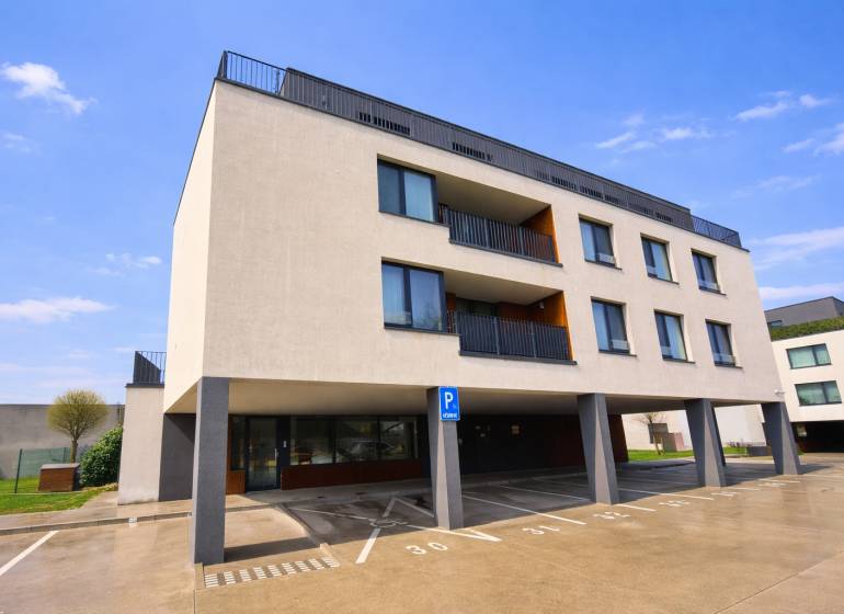 Exterior of the building with a parking lot on Na piesku street, Bratislava - Ružinov.