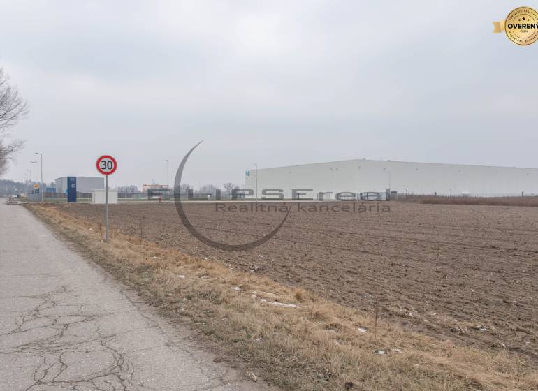Industrial Street in Zohor with a view of commercial plots and industrial buildings.