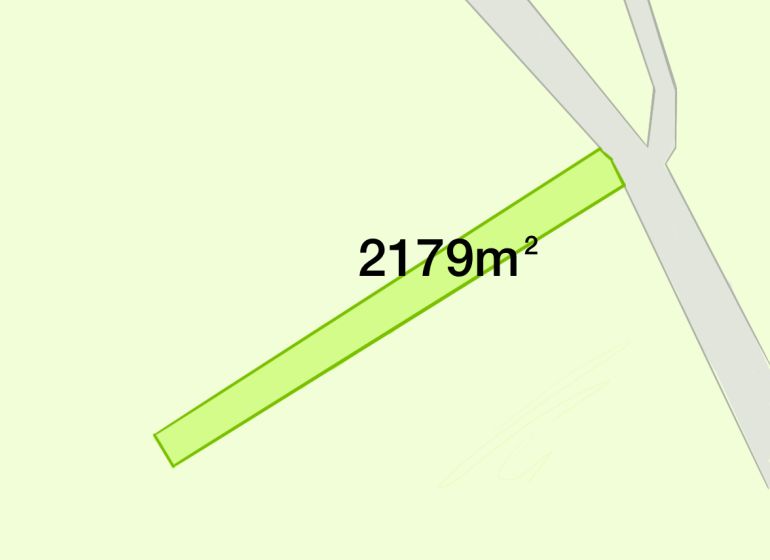 A residential plot in Horná Poruba with an area of 2179 m², by the road.