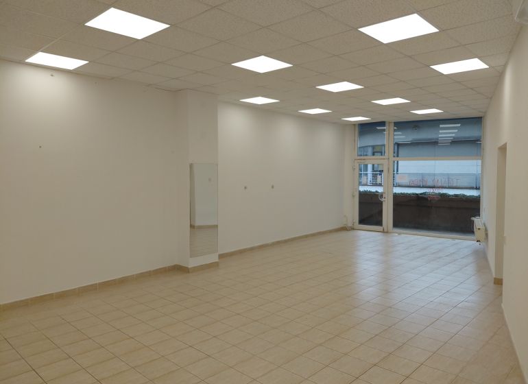 Bright commercial spaces with tiles and large windows.