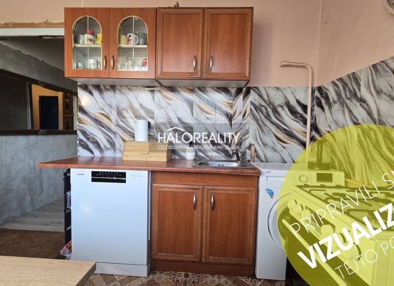 A kitchen unit with patterned tiles in a 3-room apartment.