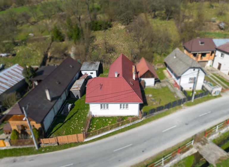 A family house in Dolná Poruba by the road on Dolná Poruba street, surrounded by a garden.