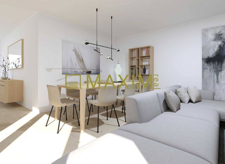 A spacious living room with a sofa and a wooden-patterned floor in a 2-room apartment.