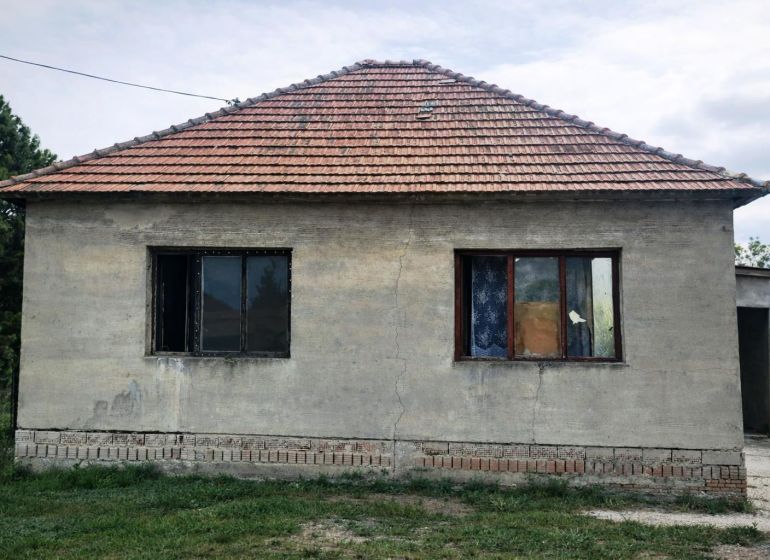 A family house in Nový Život on Malý Máger - Tonkovce Street with a simple facade and a brick roof.