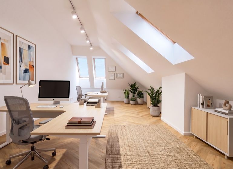 Offices with wood-patterned flooring, two desks, chairs, and plants.