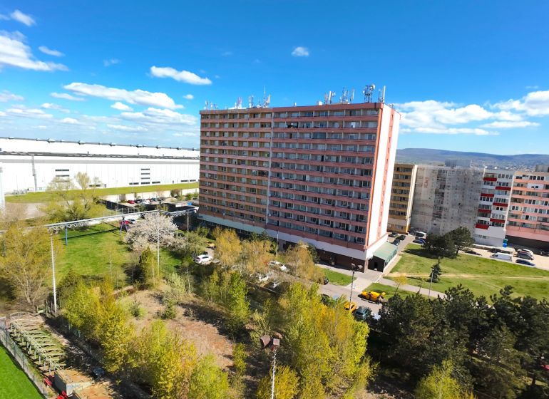 Apartment building in Bratislava, Devínska Nová Ves, Jána Jonáša, surrounded by greenery.
