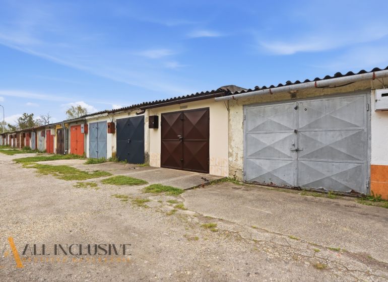 Garages on Hviezdna Street in Komárno with colorful doors and a concrete surface.