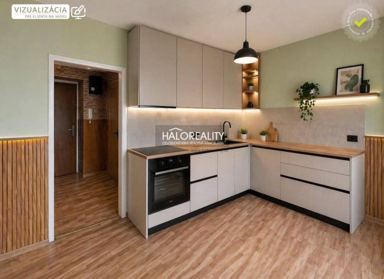A kitchen with wood-patterned flooring and light-colored cabinets in a studio apartment.