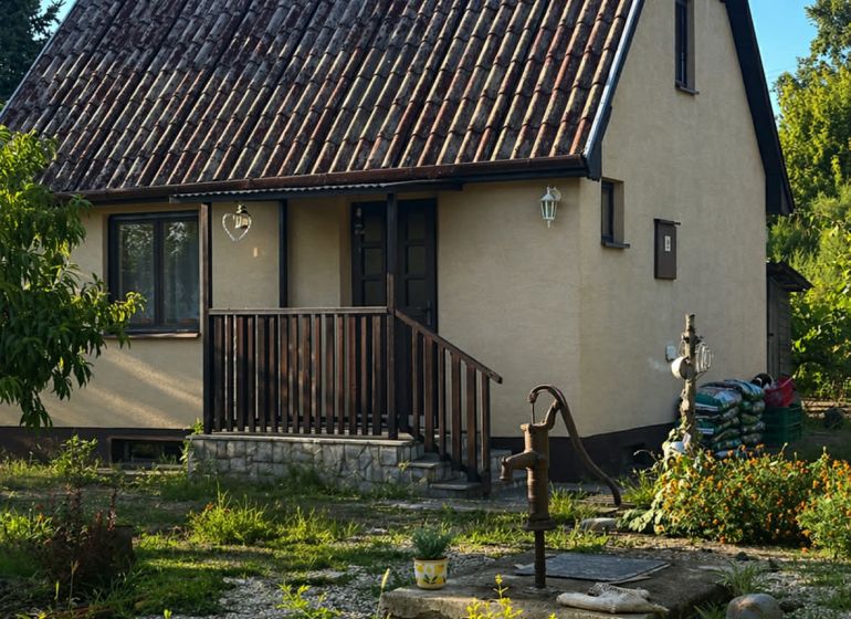 A family house with an old roof and a garden on Pri stanici Street in Chotín.