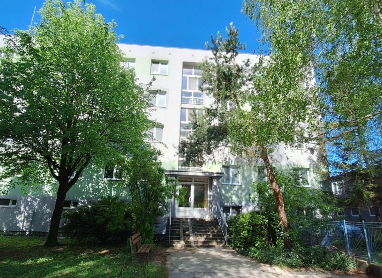 An apartment building surrounded by trees on Vrbovská Street in Piešťany.