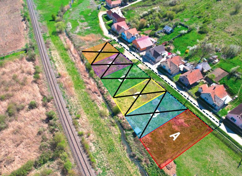 Aerial view of divided residential plots in Hodejov near the railway.