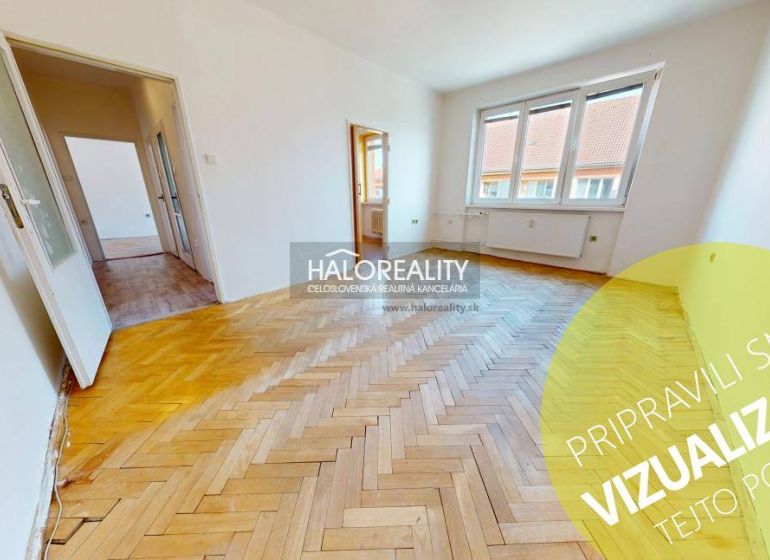 Bright living room with wood-patterned flooring in a two-room apartment.