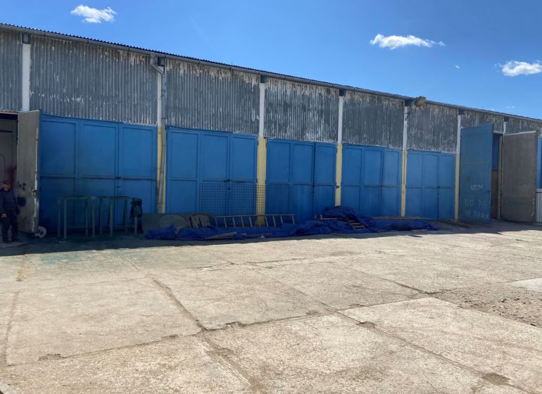 An industrial building with closed blue gates on Košická Street in Rimavská Sobota.