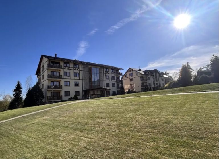 Buildings and grassy area in Stará Lesná, on Stará Lesná street, near a 3-room apartment.