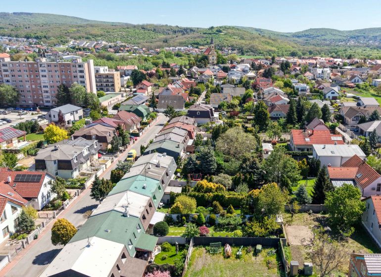 Aerial view of family houses on Hollého Street in Stupava with beautiful garden architecture.