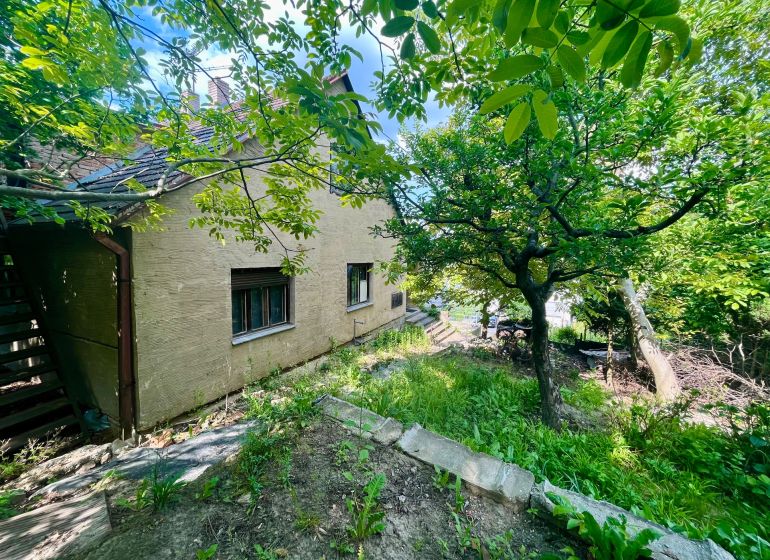A family house with a large garden surrounded by greenery on Búdková in Bratislava - Staré Mesto.