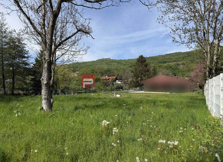 Residential plots in Borinka with views of greenery and surrounding hills.