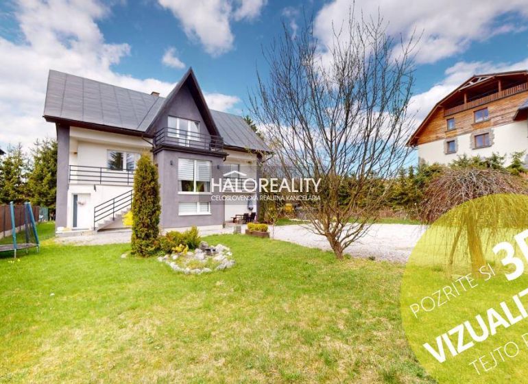 A family house in Vitanová with a nicely maintained garden and a view of the surrounding houses.