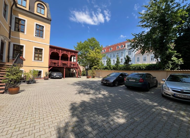 Parking lot at the offices on Grösslingova Street in Bratislava - Old Town with cars.