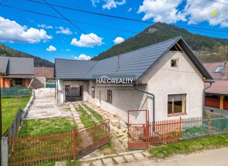 A family house in Stupno with a courtyard, garden, and surrounding hills.